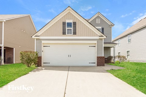 a white garage door in front of a house