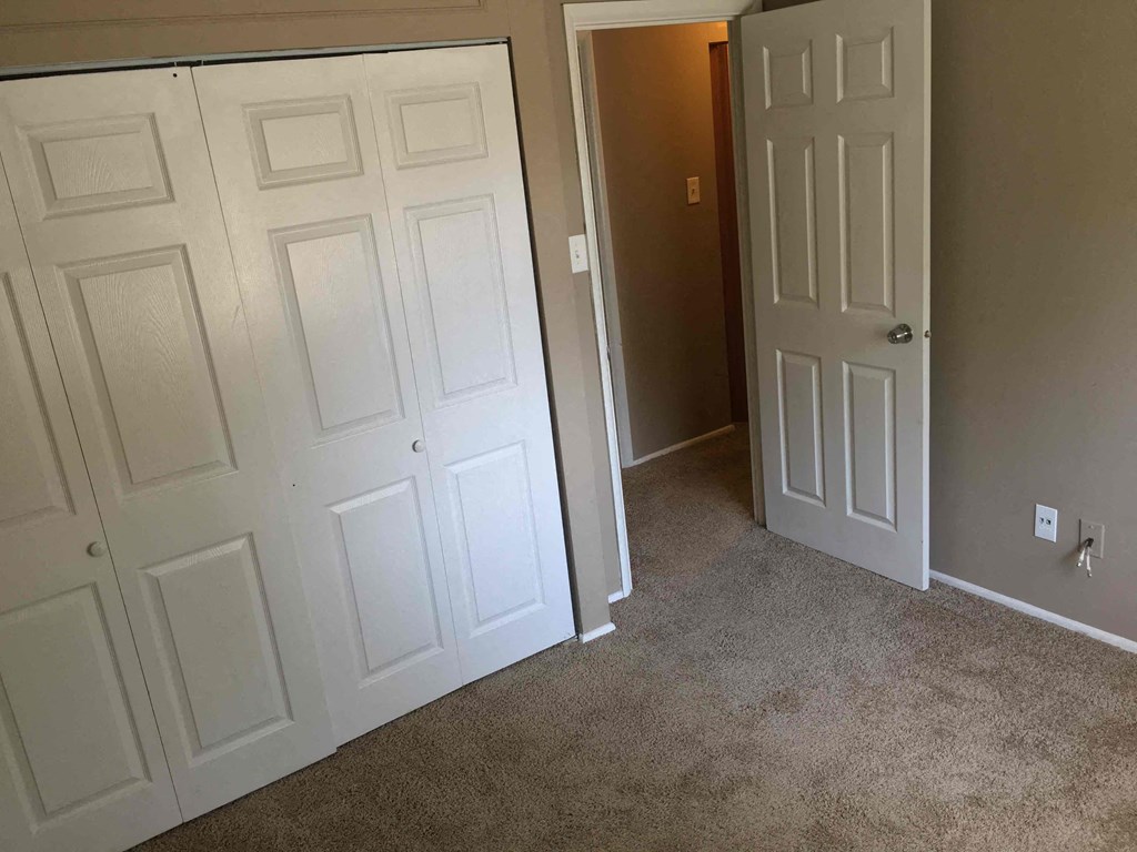 A white door is on the left and a white door is on the right.