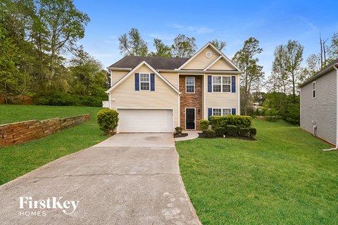 A house with a driveway in front of it.
