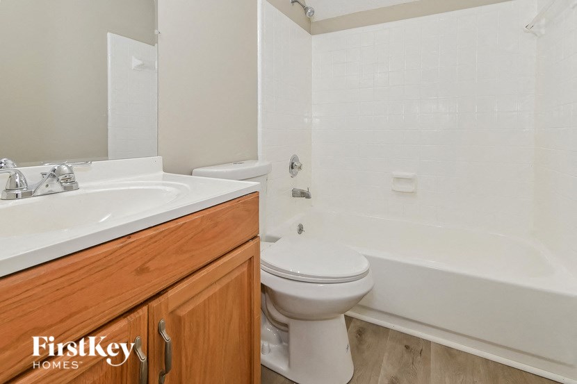 a bathroom with a sink toilet and a bath tub