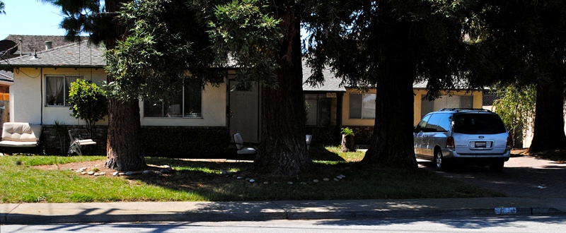Side view of the beige house with brick wall siding with a large green front lawn and a tree in the right hand side of the property Prodesse Property Group 1070 & 1072 Arroyo Seco Drive Campbell, CA 