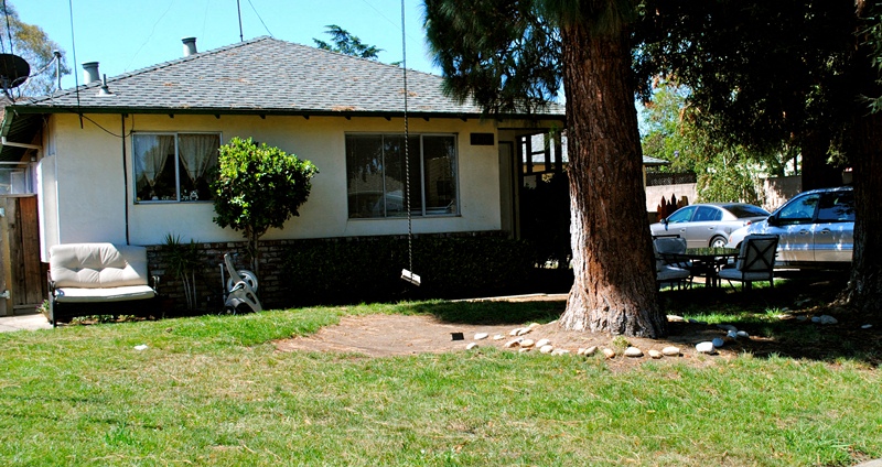 Entrance view of a white house with green trim and brick siding a 2 car entrance driveway Prodesse Property Group 1070 & 1072 Arroyo Seco Drive Campbell, CA 95008