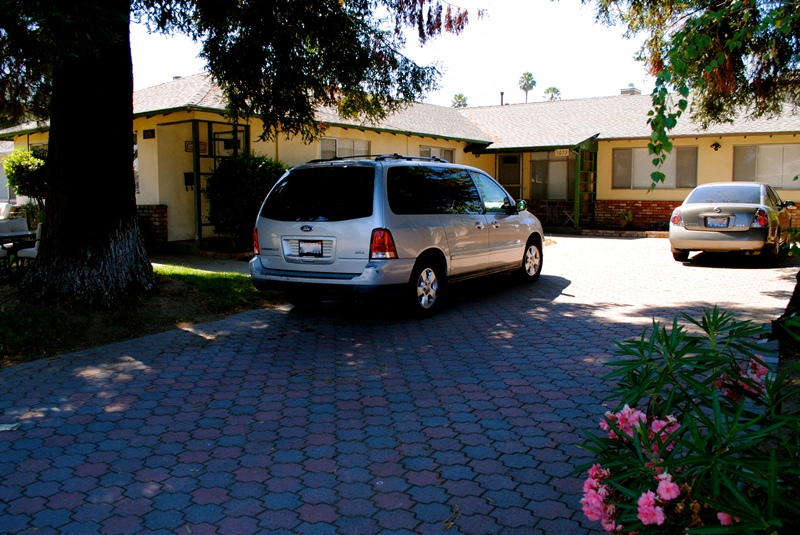 Front entrance driveway with a van parked in front a yellow house with green trim and a large tree located in the front left of the yard Prodesse Property Group 1070 & 1072 Arroyo Seco Drive Campbell