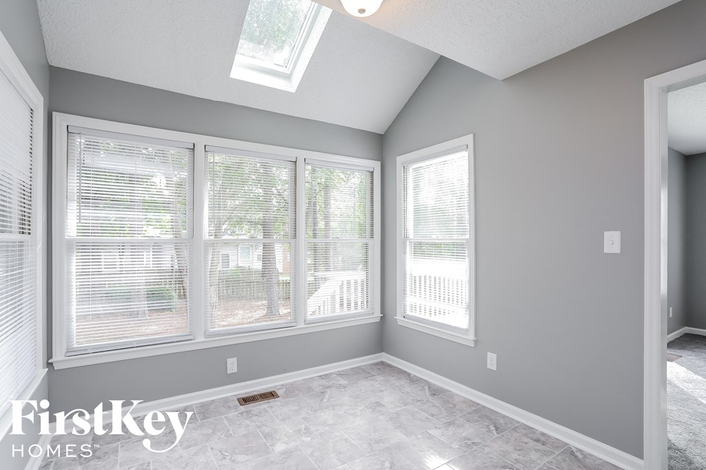 the living room of a new home with large windows