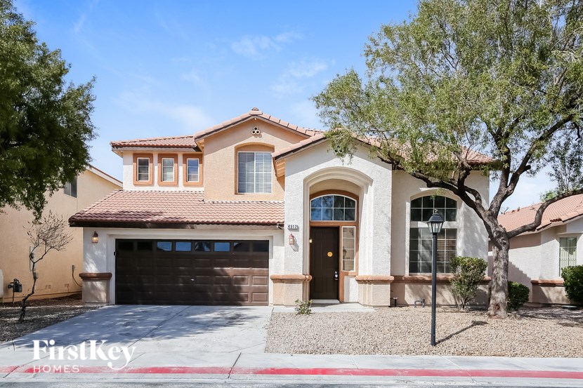 A house with a brown roof and a garage door.