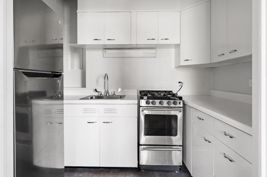 a kitchen with a stove and a sink