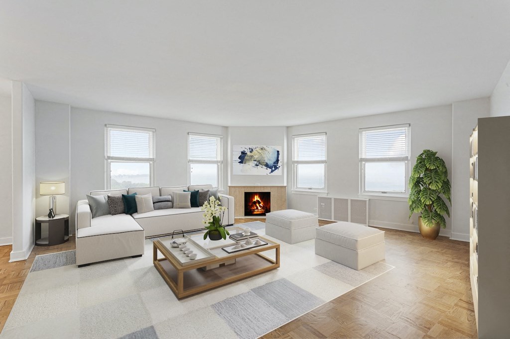 a living room with a couch and a coffee table and a fireplace