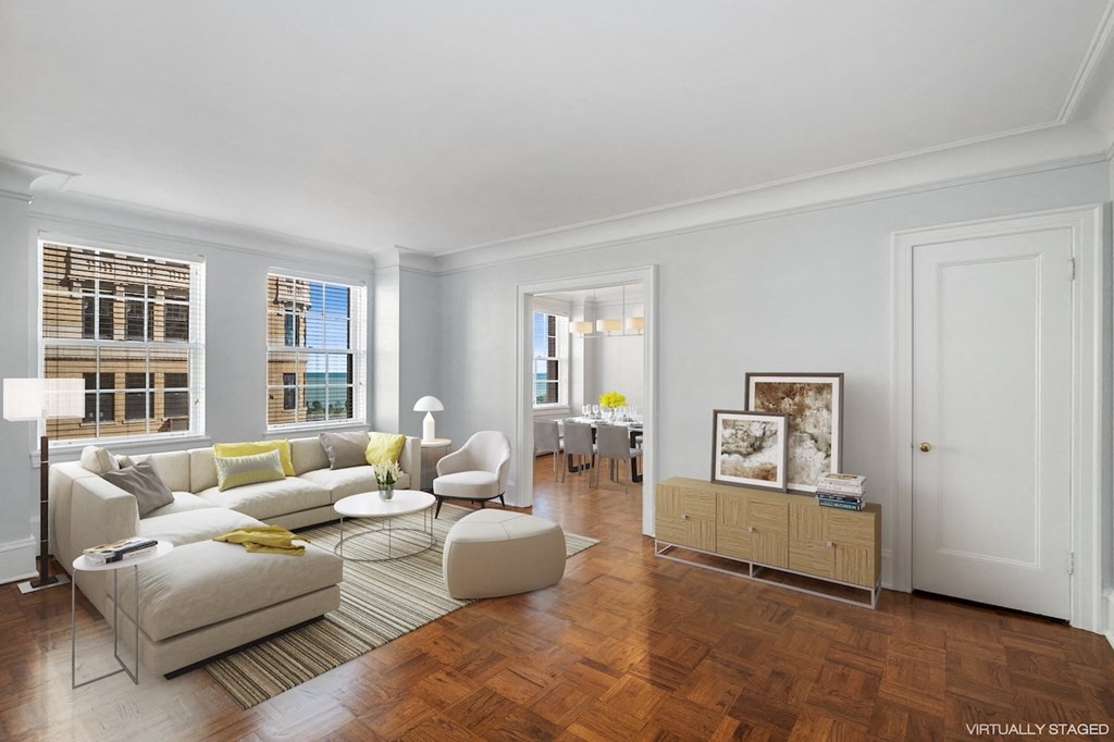 a living room with a couch and a chair and a table