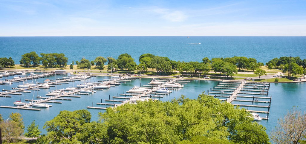 an aerial view of a marina with boats on the water