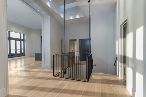 a large room with a staircase in the middle of it