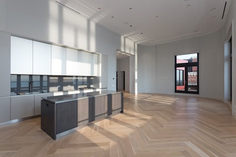 a large room with a large island in the middle of it