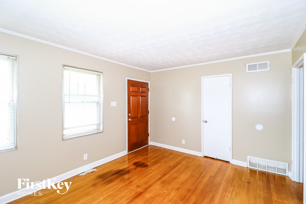 A room with a wooden floor and a white ceiling.