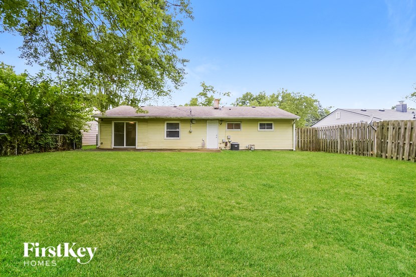A house with a lawn in front of it.
