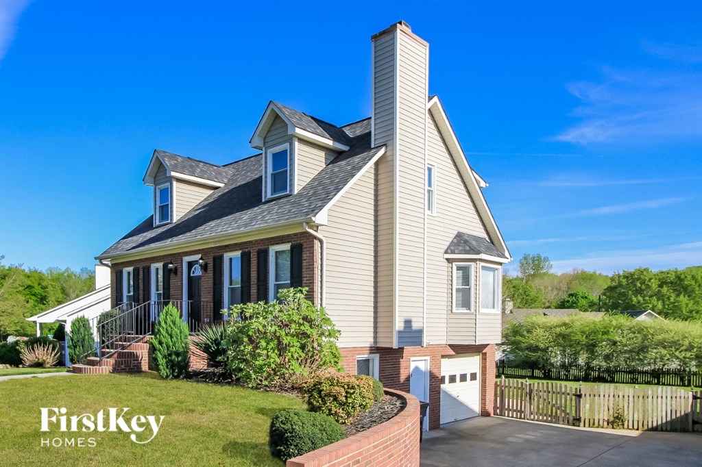 a home with a front porch and a lawn