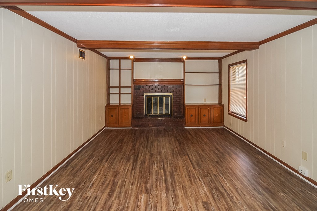 A room with wooden floors and a tatami mat area.