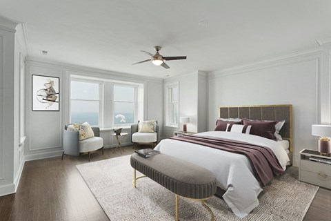 a bedroom with a bed and a ceiling fan