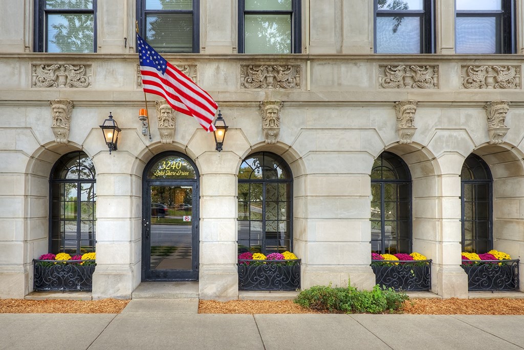 the facade of a building with an flag on the side