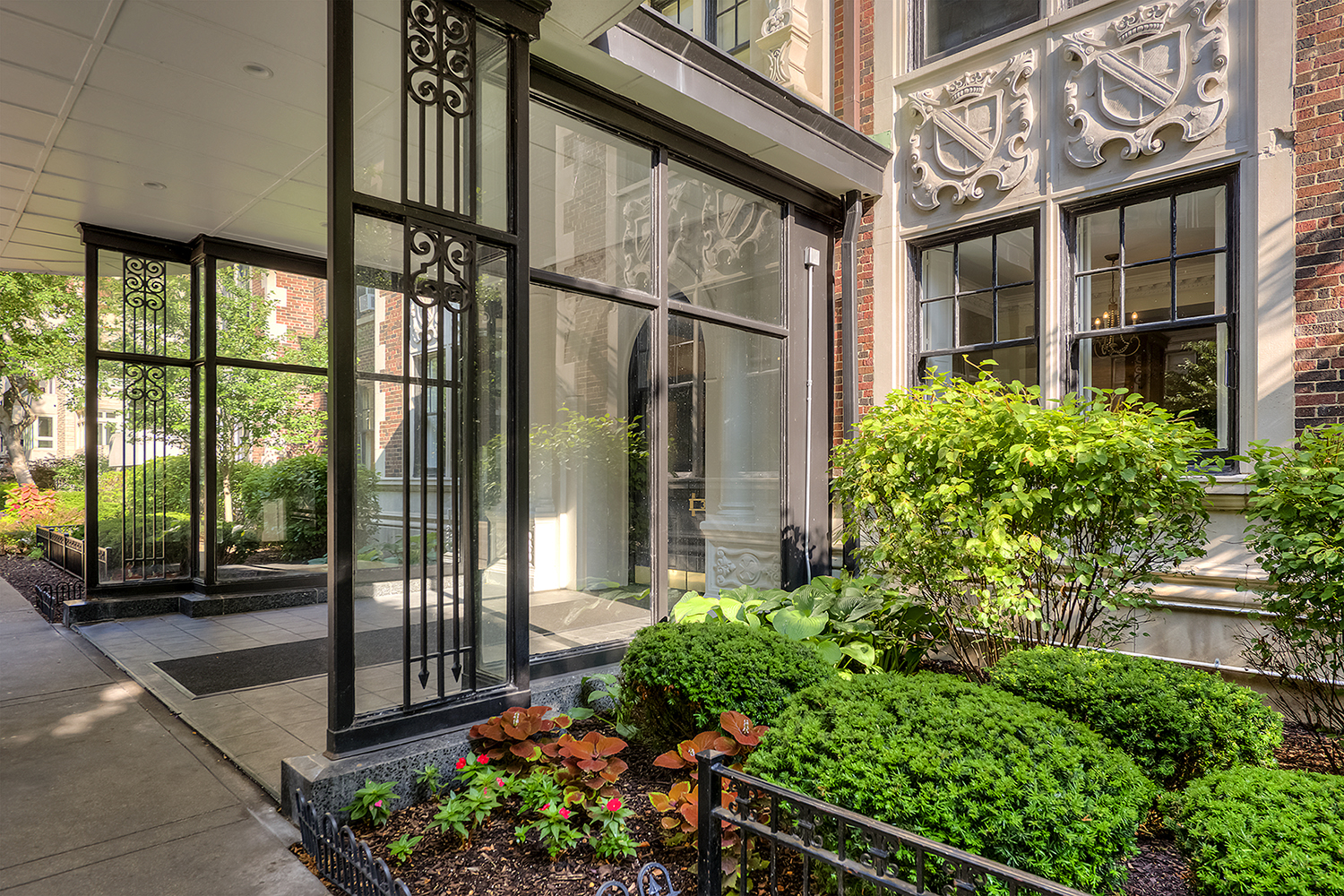 front door of a house with a garden in front of it