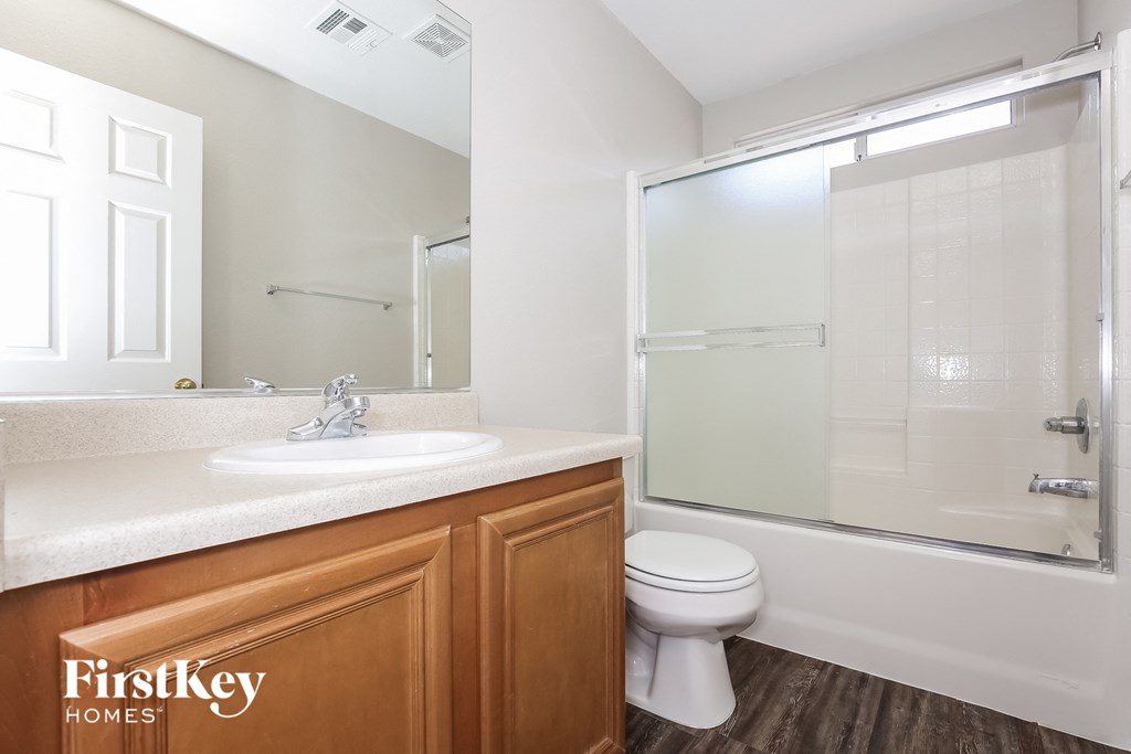 a bathroom with a sink toilet and a shower