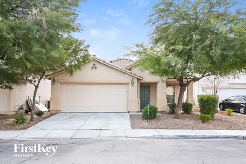 a home with a driveway and a garage door