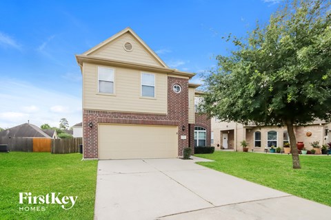 A house with a garage is for sale by FirstKey Homes.