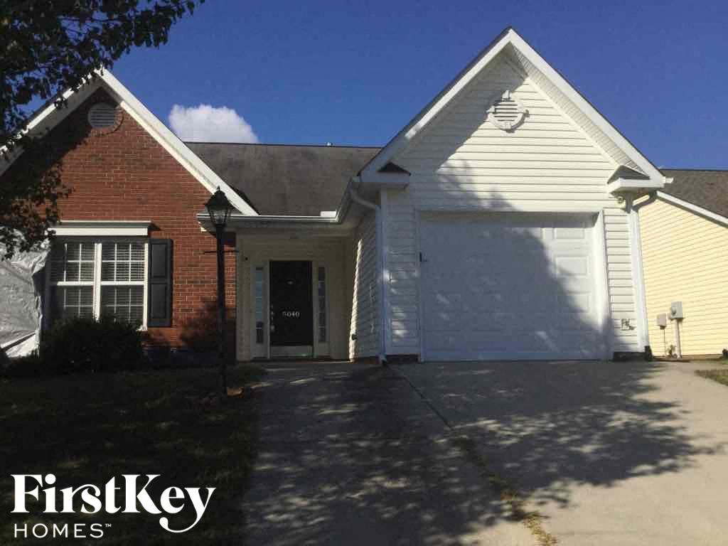a house with a driveway and a garage door