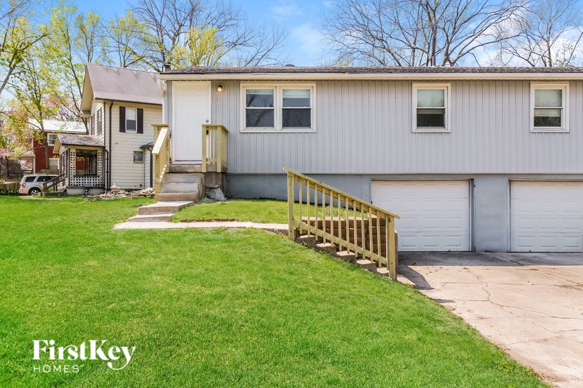 A house with a garage and a small front yard.