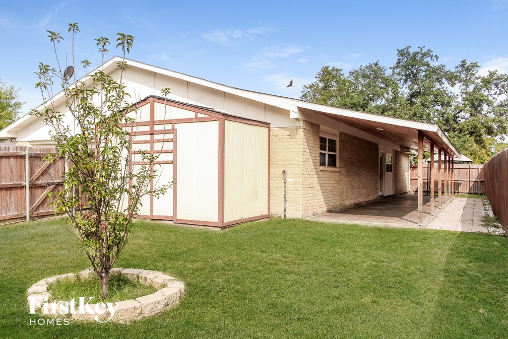 a house with a yard and a tree