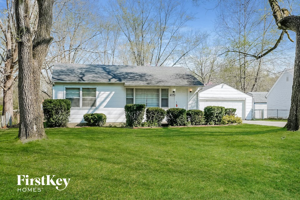 A house with a lawn in front of it.