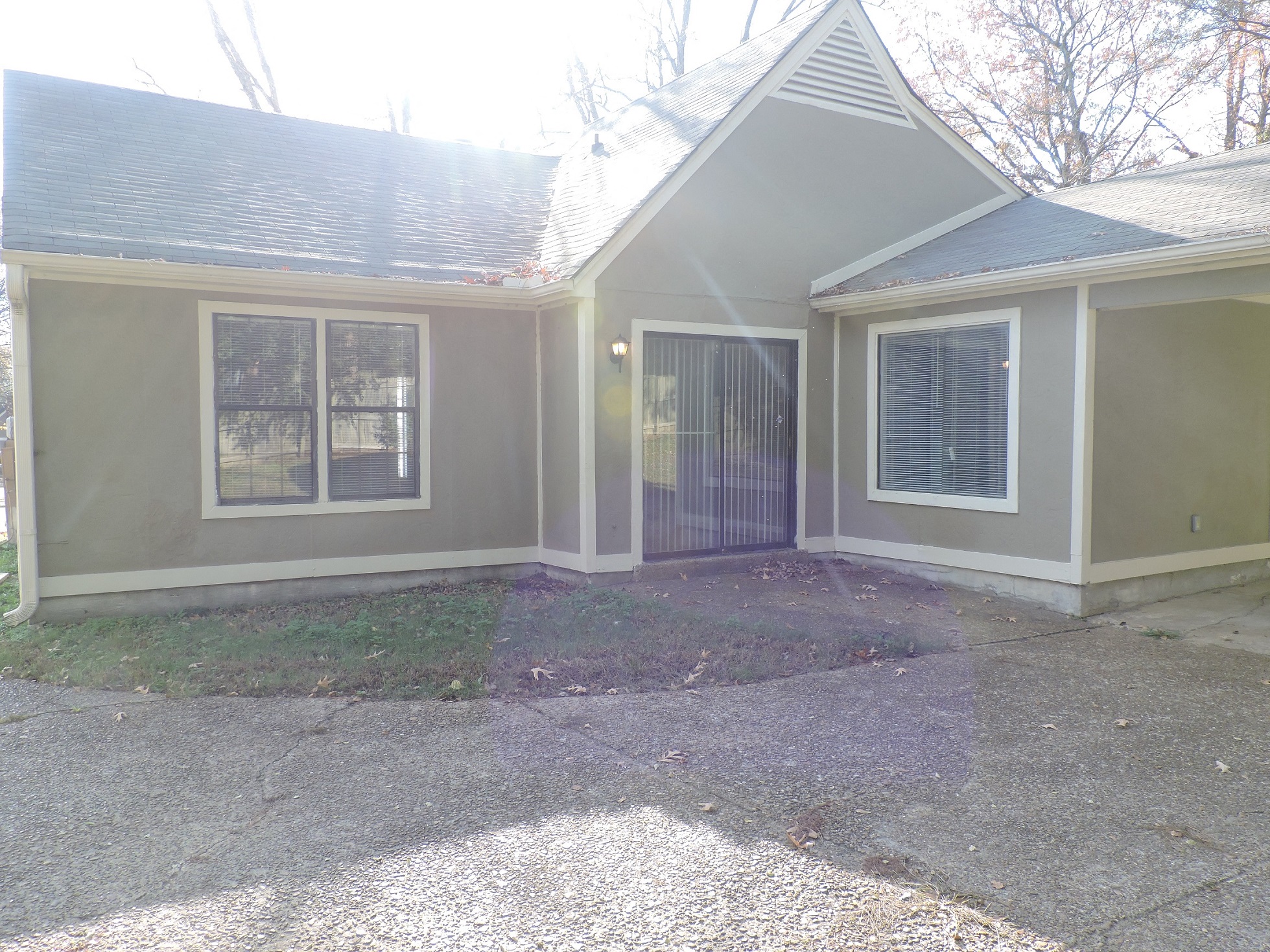 a view of the front of a house with a garage door