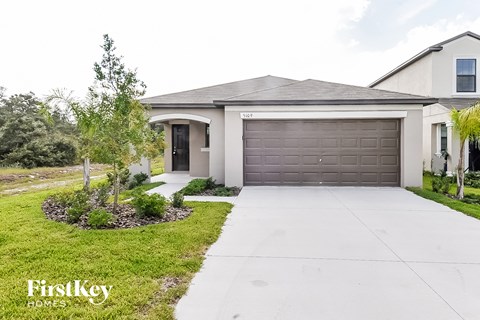 a house with a driveway and a garage door