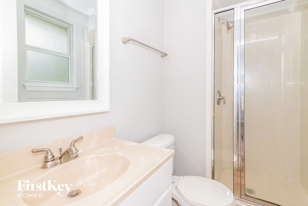 a bathroom with a sink and a shower