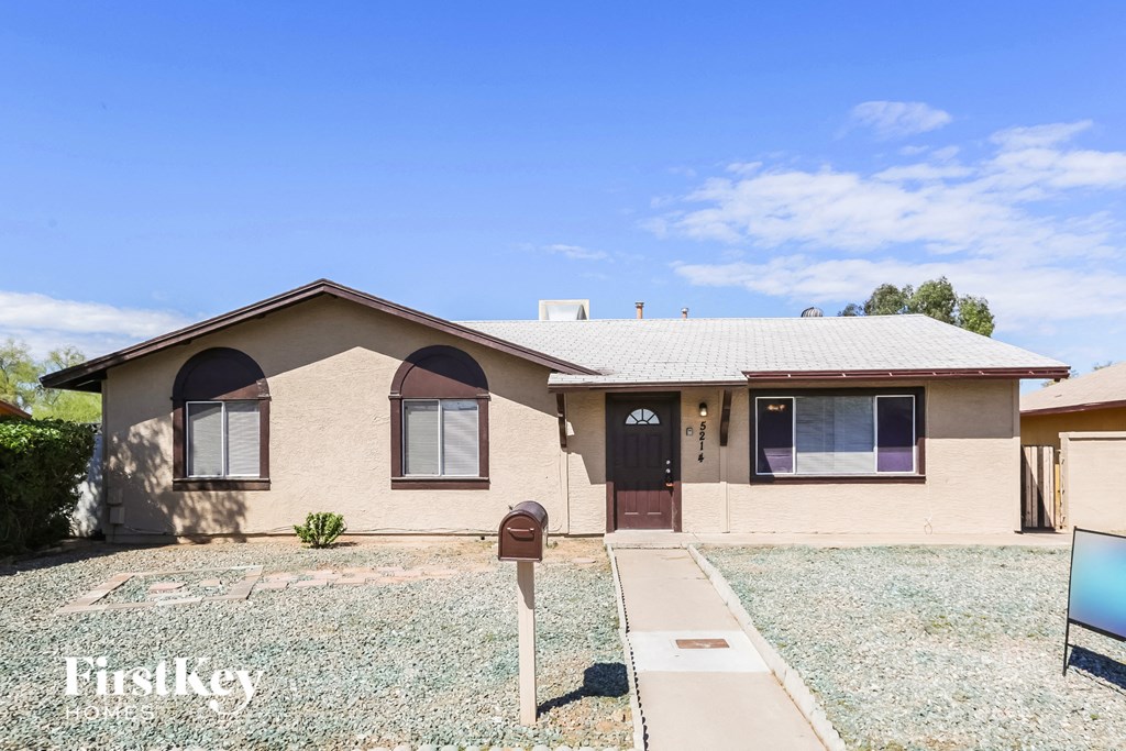 a home with a parking meter in front of it