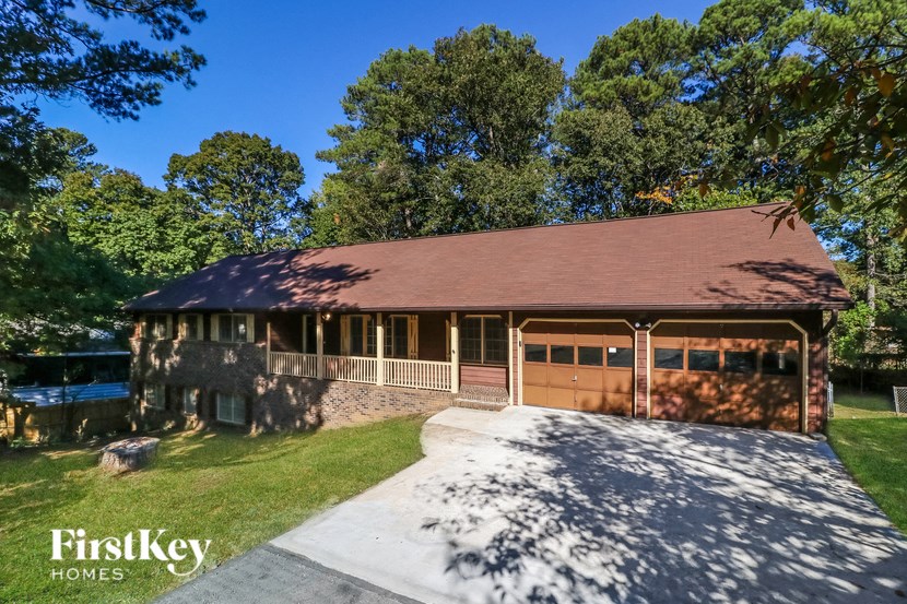 the front of a house with a garage and a driveway