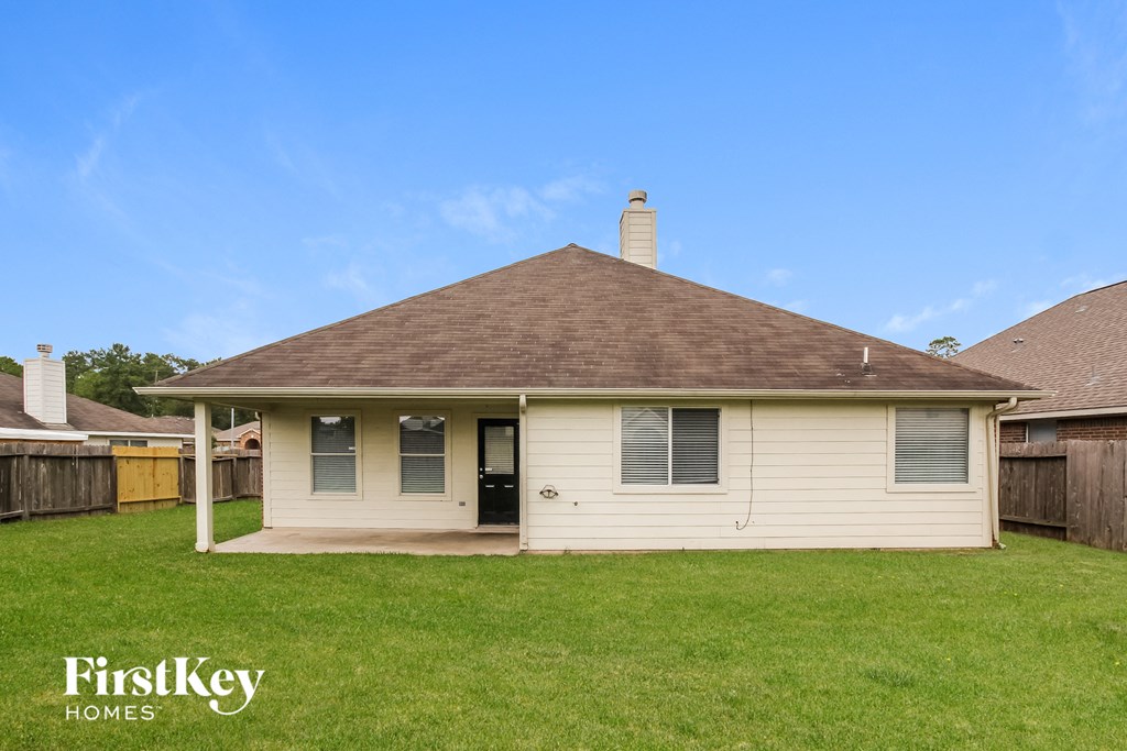 A house with a brown roof and a white wall is shown with the words "FirstKey Homes" on the bottom left.