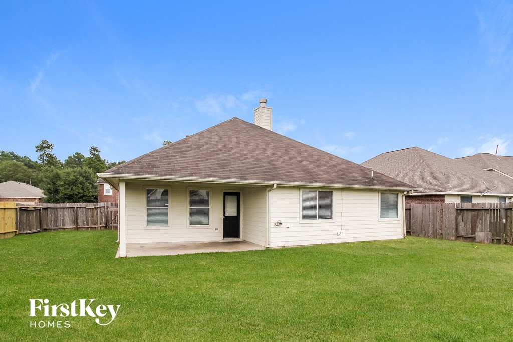 A house with a brown roof and a chimney is for sale.