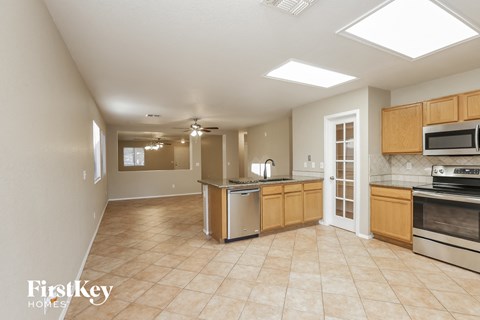 A kitchen with a stove top oven and microwave.