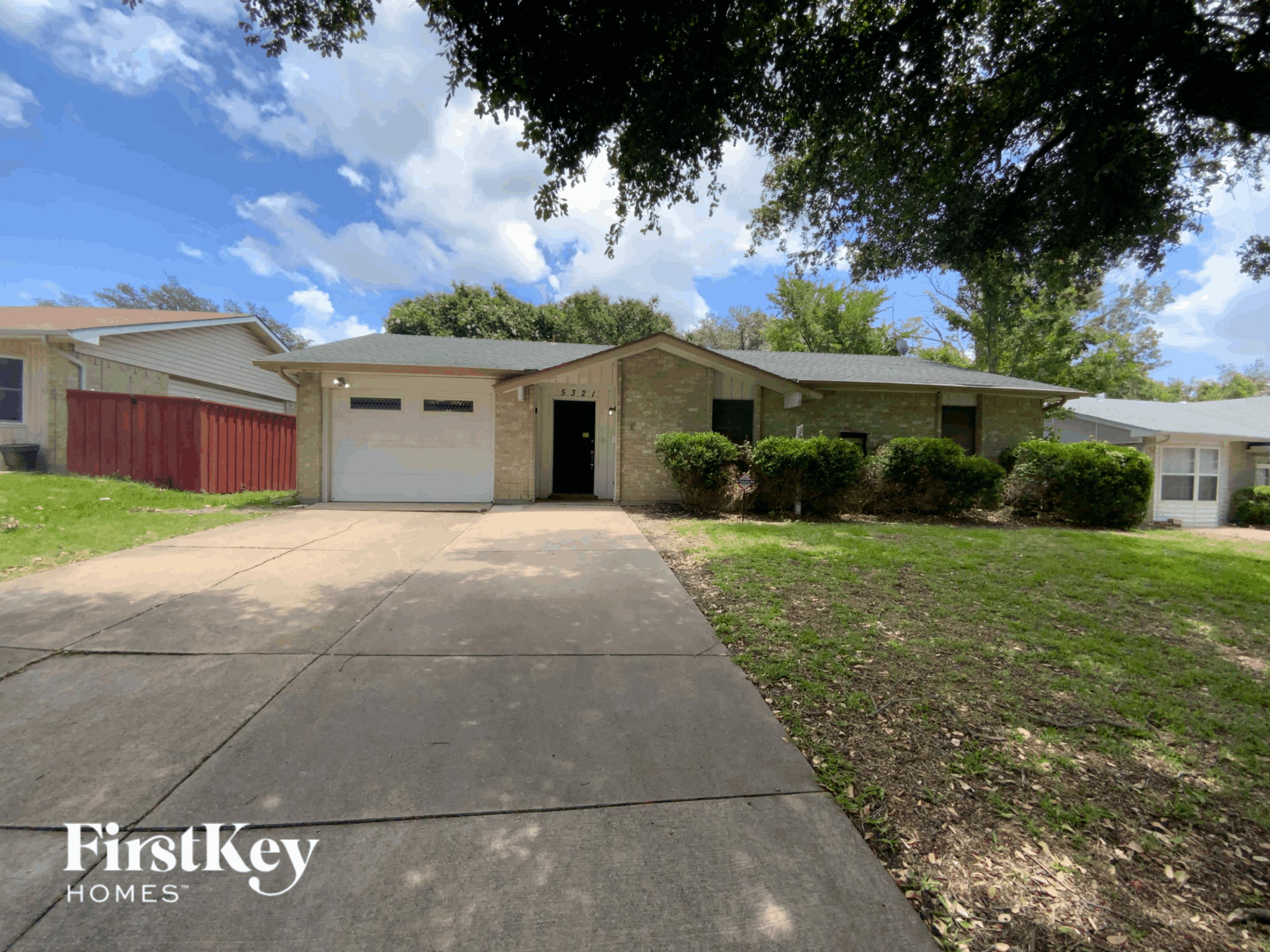 a house with a driveway and a garage door