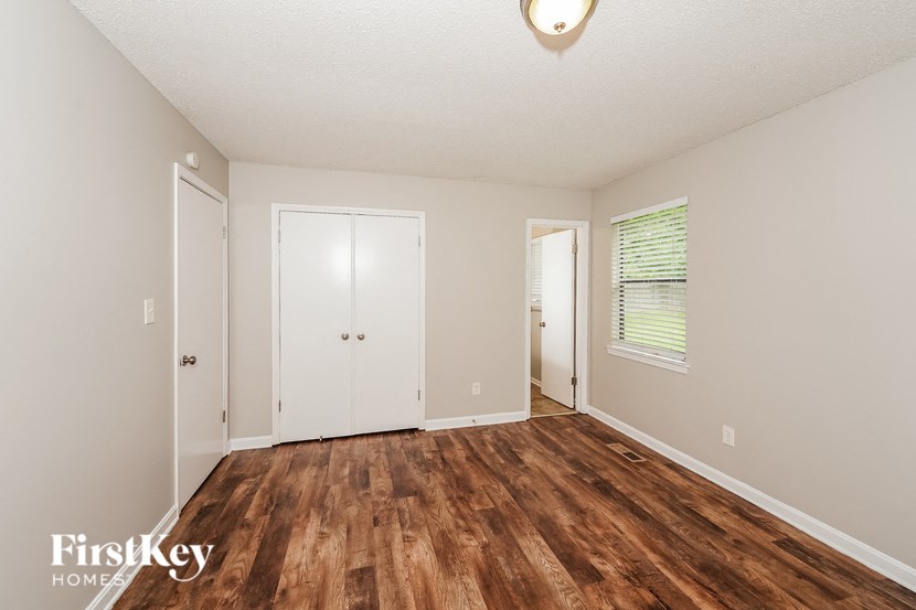 the living room of a house with a wood floor
