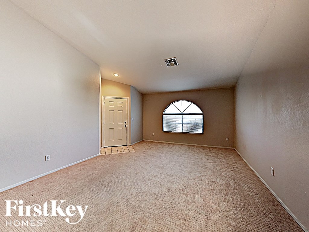 A room with a door and a window with a FirstKey Homes logo.