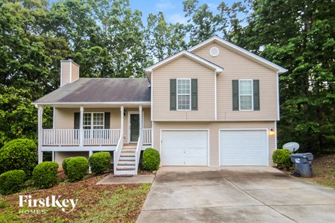 A house with a garage and a driveway is shown.