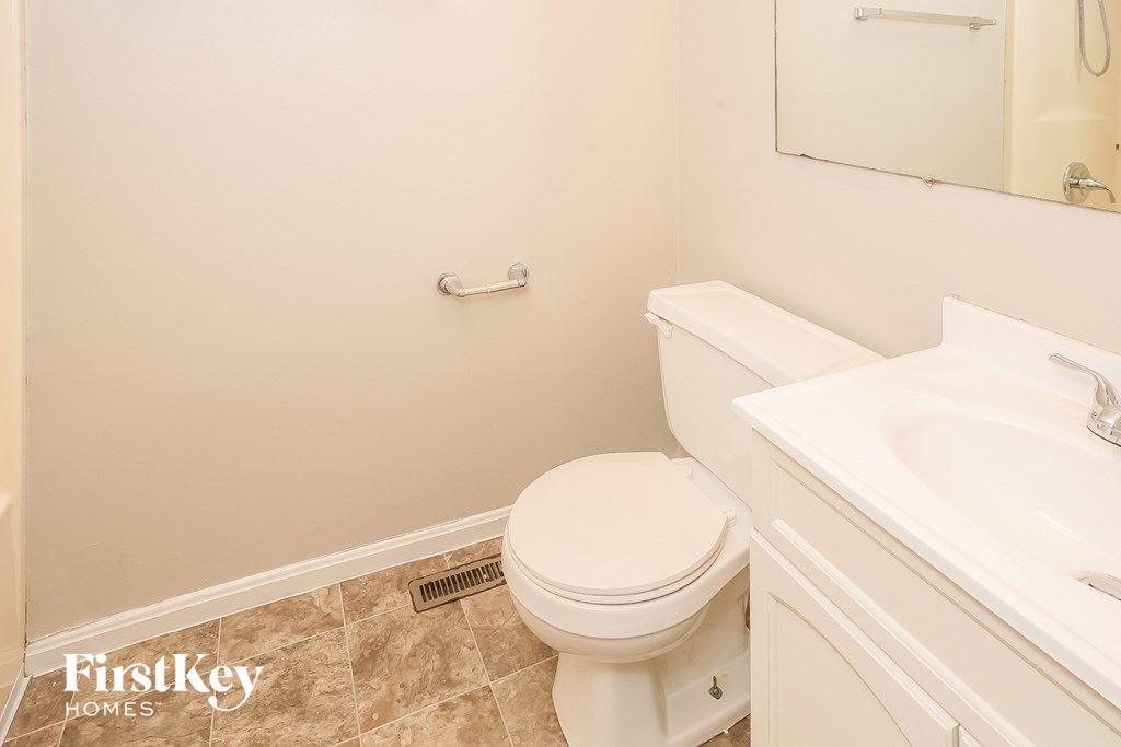a bathroom with a toilet and a sink