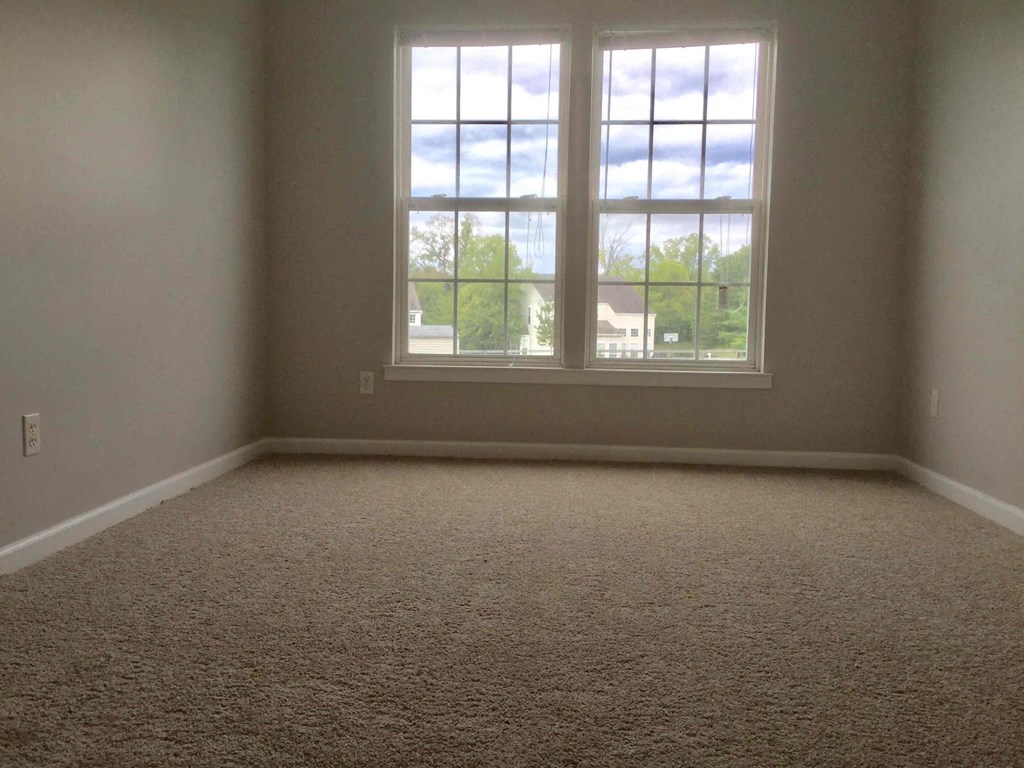 an empty room with a large window