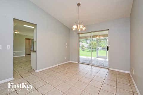 the living room and dining room are spacious and open to the backyard