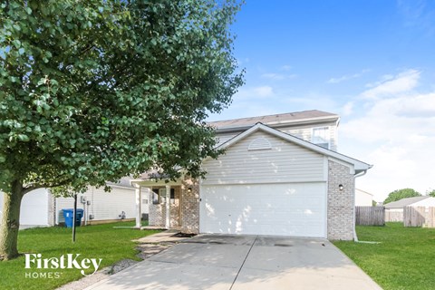 A house with a garage is for sale by FirstKey Homes.