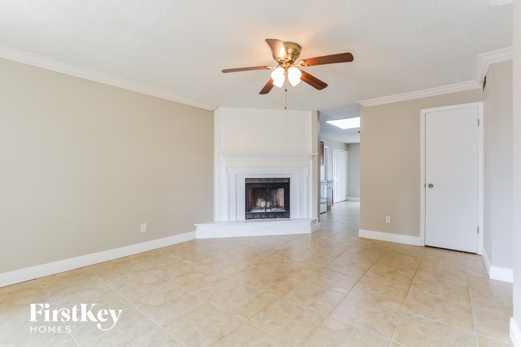 the living room and dining room with the fireplace