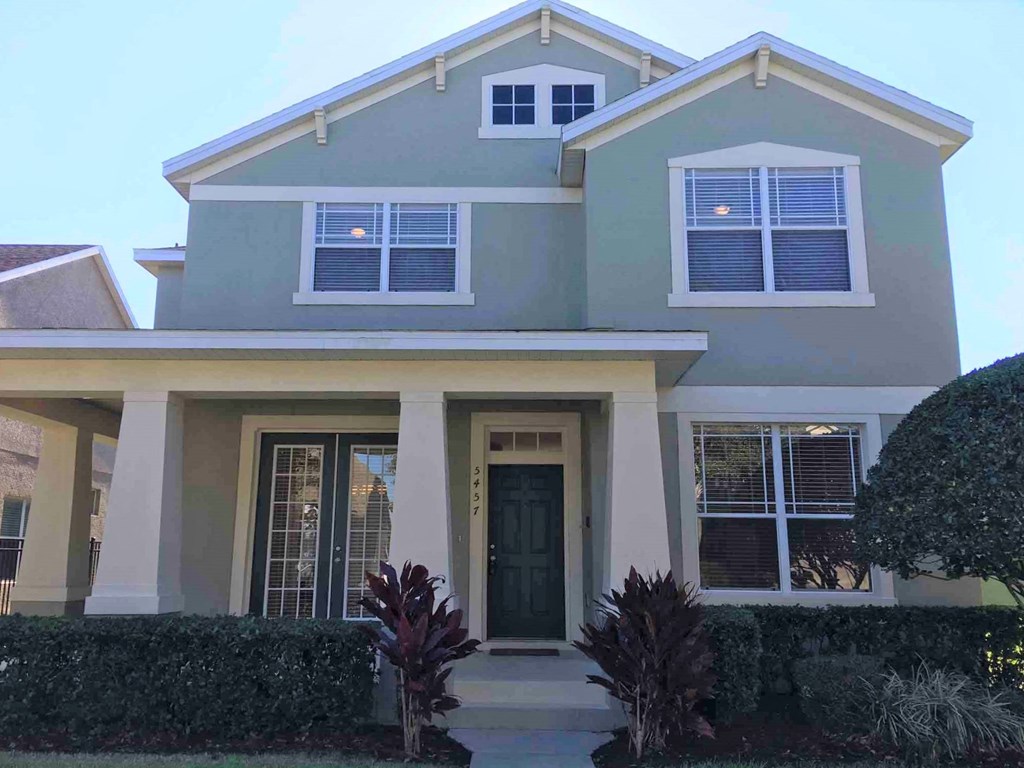A house with a green door and white trim.