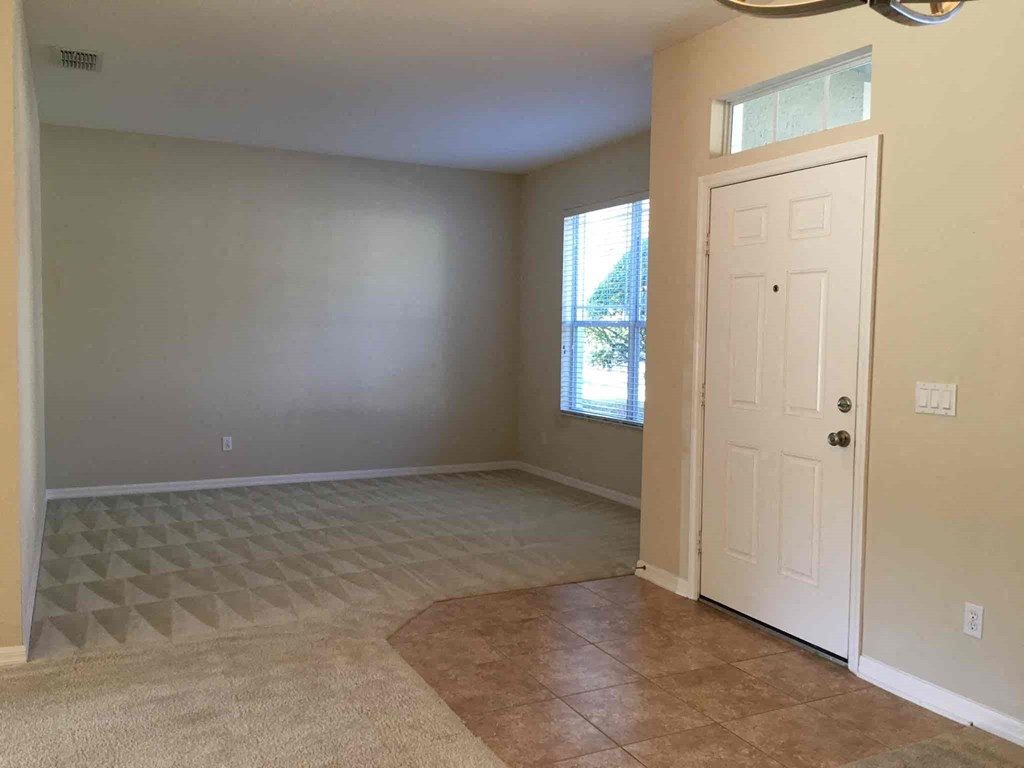 A room with a door and a window.