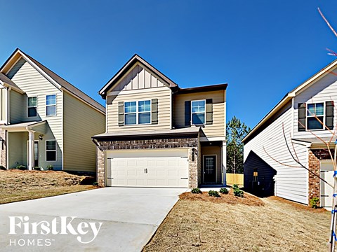 a single story home with a white garage door