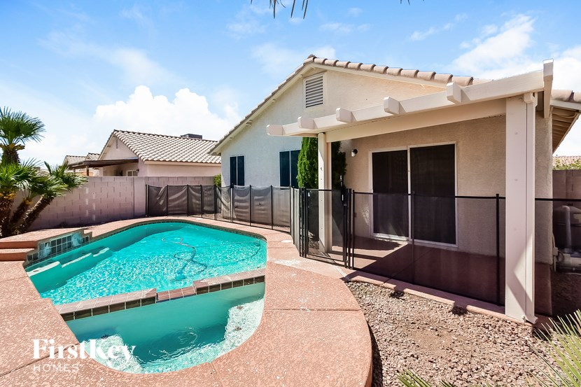 A house with a pool in the backyard.